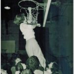 1953-54 Farmington High School Girls Basketball Team Captain Emma Sue Brock Allen cutting down the net for winning County tournament.